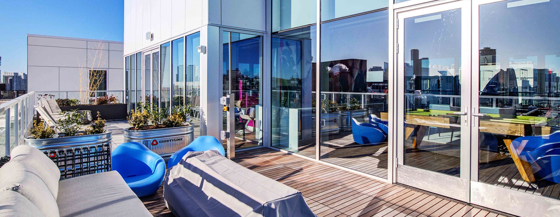 Large outdoor patio with fire pits and plenty of seating overlooking the ocean 